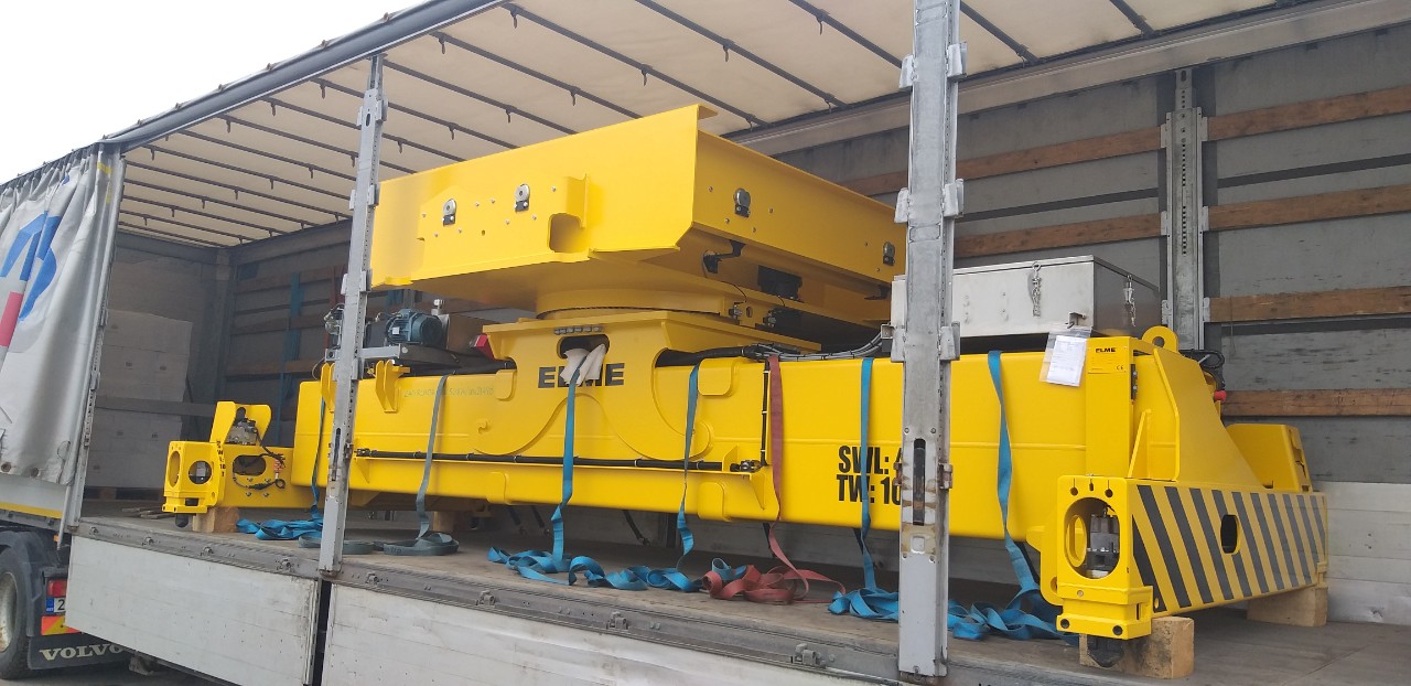 Industrial equipment secured with straps inside a curtainsider trailer